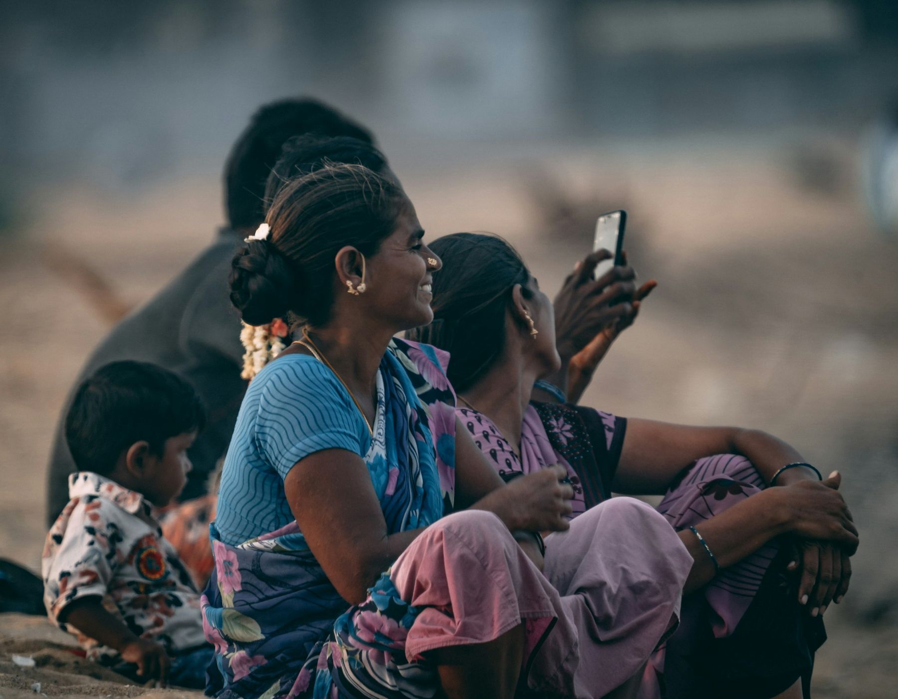 Women looking at a mobile phone together